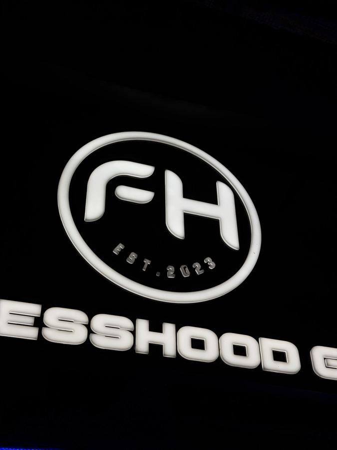 The lit FitnessHood sign